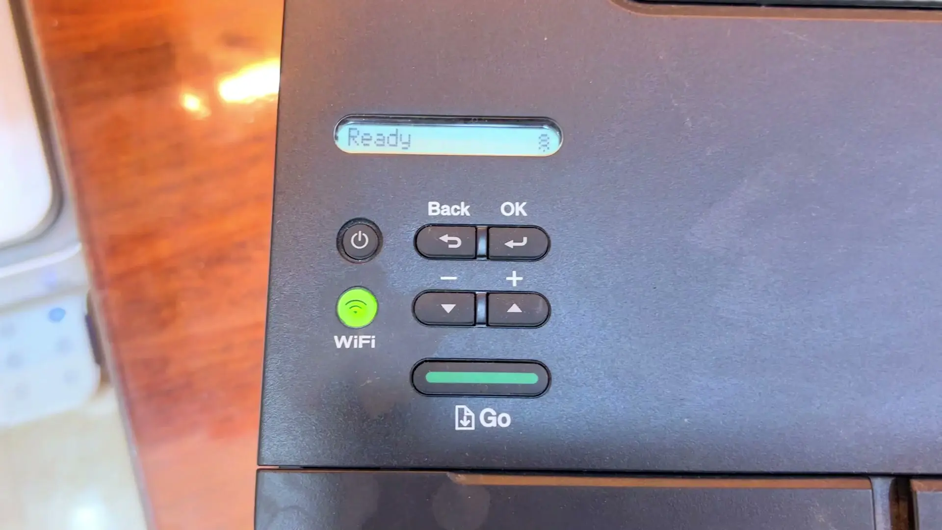 The Brother printer's LCD reading Ready, next to the Back, OK and Go buttons