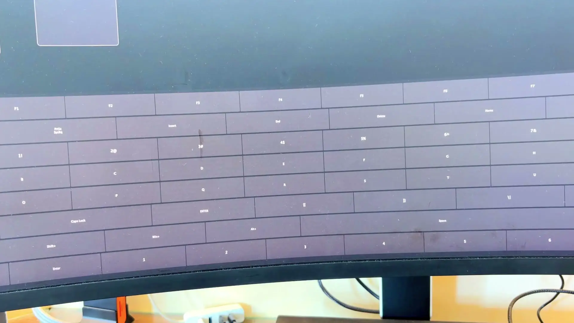MacBook screen showing third-party macro remapping software with a keyboard layout grid