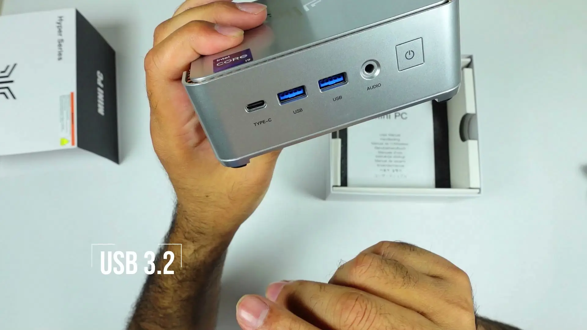 Front of the KAMRUI Hyper H2 with one USB-C port, two USB-A ports, an audio jack and the power button