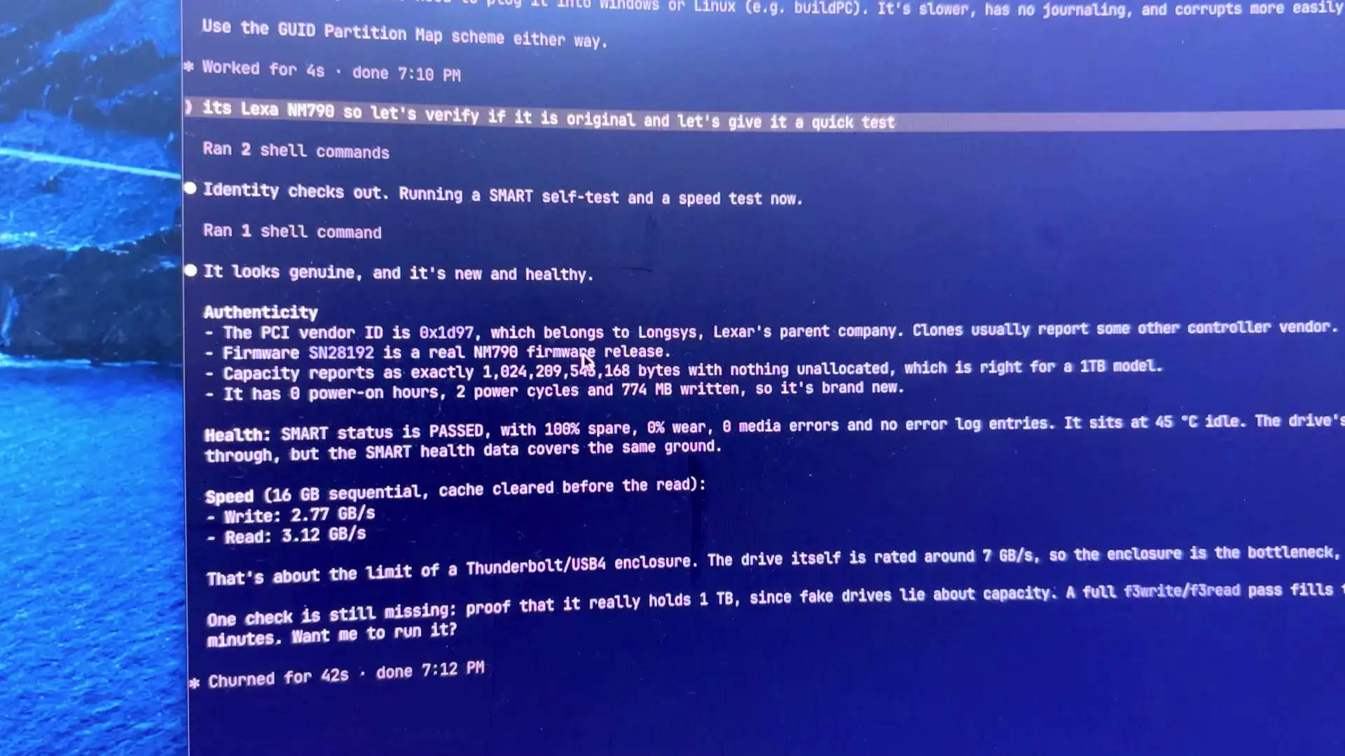 Claude's on-screen result reading It looks genuine, and it's new and healthy, with vendor ID 0x1d97 for Longsys, SMART status PASSED, write 2.77 GB/s and read 3.12 GB/s