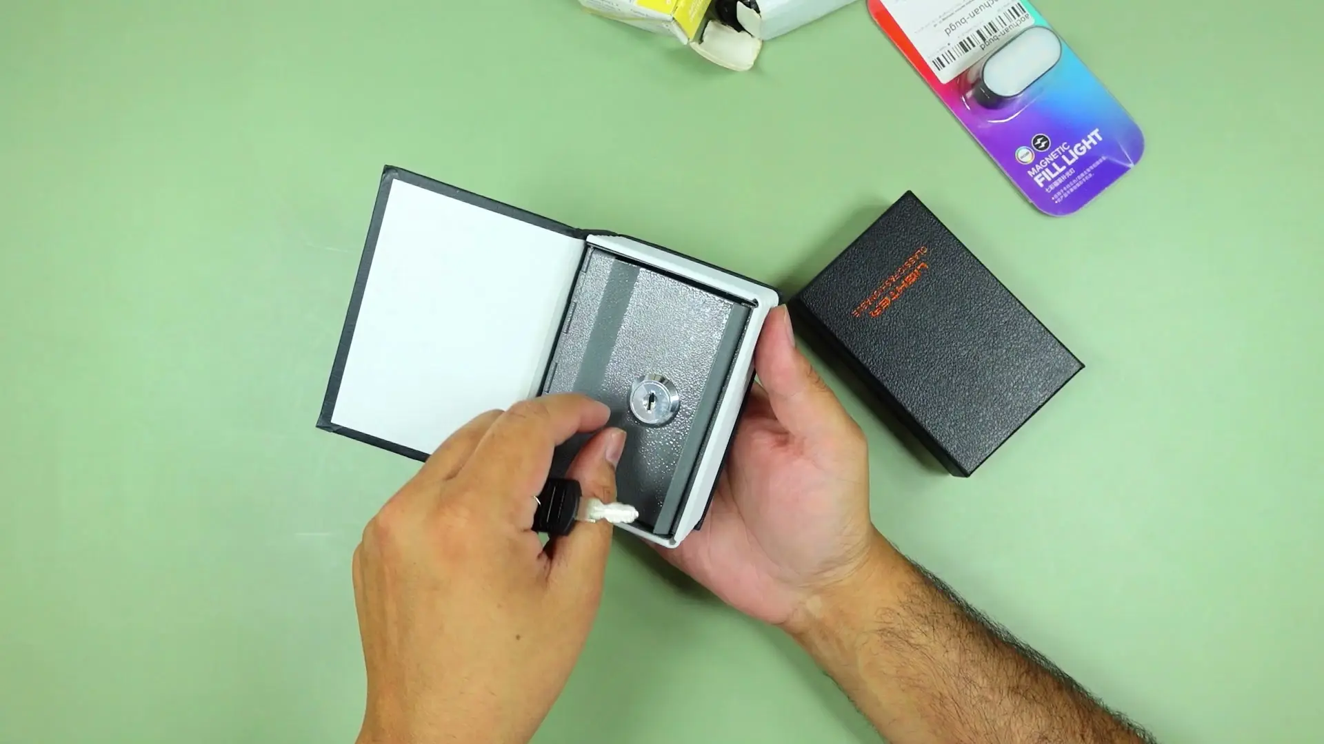 The dictionary book safe opened to reveal its keyed metal lock mechanism inside