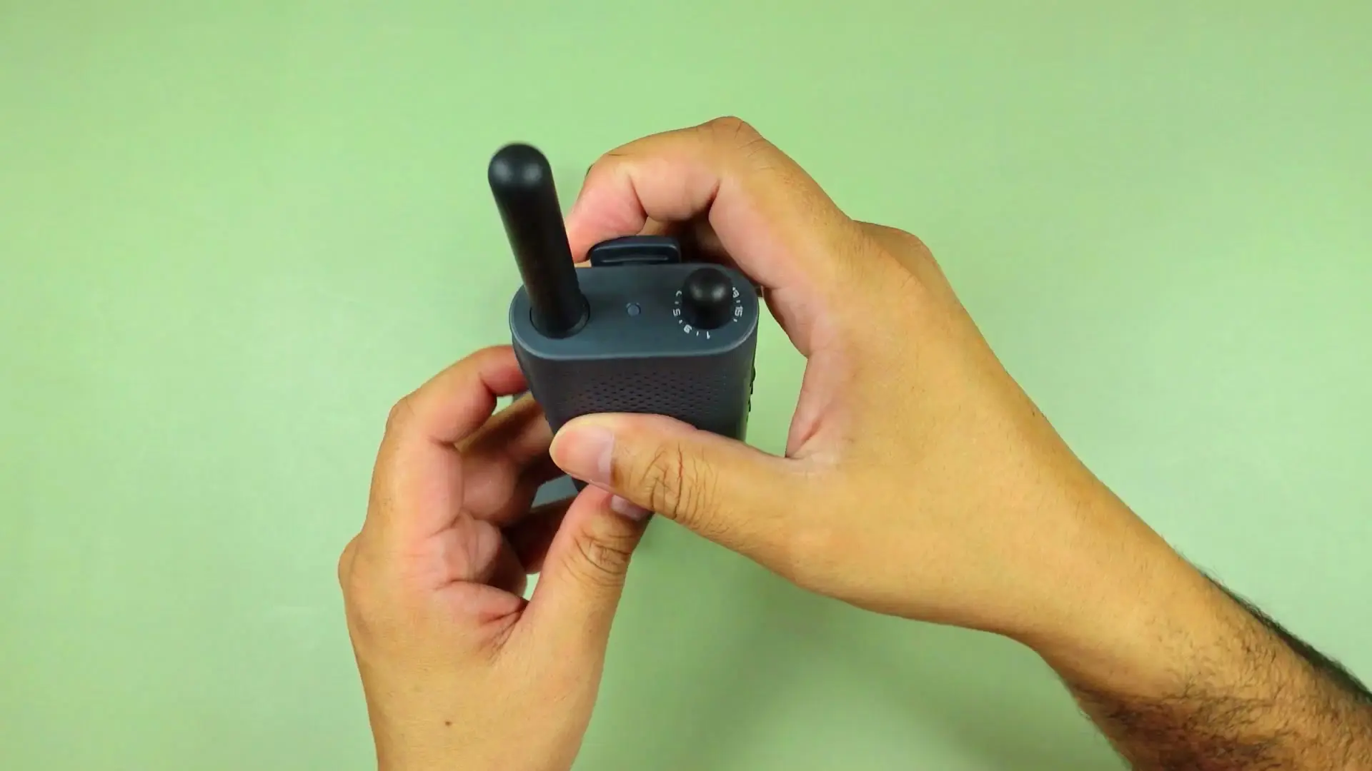 Close-up of Xiaomi Walkie Talkie 3 Lite showing orange-accent channel dial and antenna