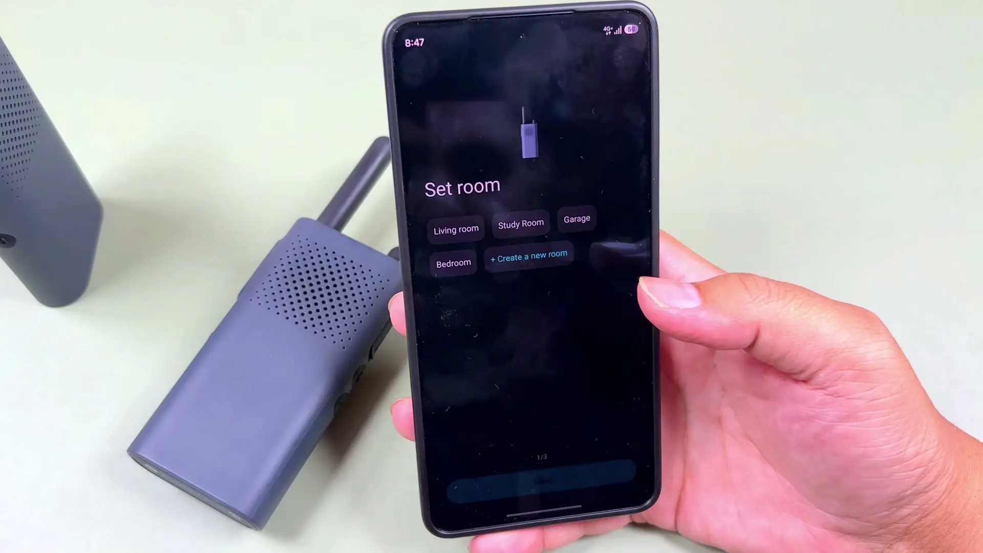 Phone screen showing Mi Home walkie talkie pairing progress with Chinese prompts